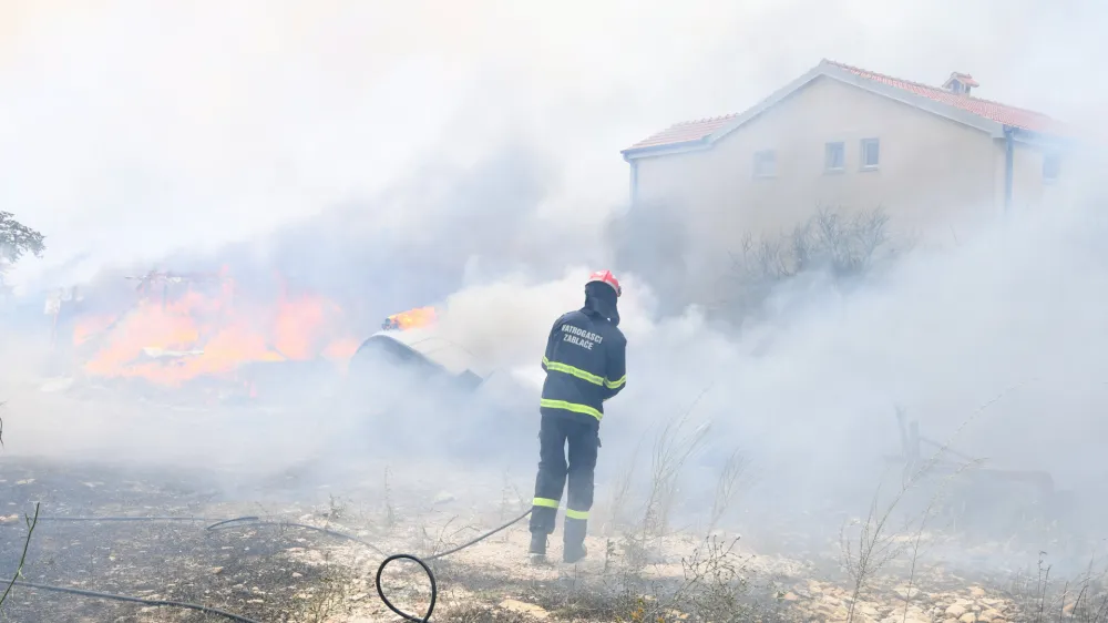 13.07.2023.,Sibenik - U gašenju požara otvorenog prostora koji je izbio na lokaciji Grebaštica u Šibensko-kninskoj županiji, trenutno sudjeluje 79 vatrogasaca sa 28 vatrogasnih vozila, Intervencijska vatrogasna postrojba Šibenik, 3 protupožarna zrakoplova Canadair CL-415, 2 protupožarna zrakoplova Air Tractor. Photo: Hrvoje Jelavic/PIXSELL