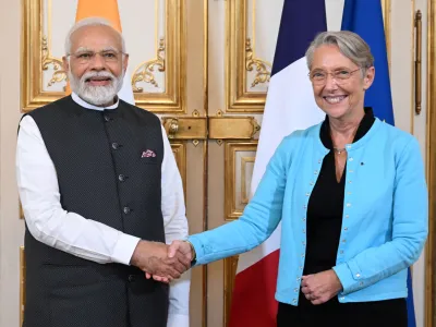 French Prime Minister Elisabeth Borne shakes hands with Indian Prime Minister Narendra Modi before their talks, Thursday, July 13, 2023 in Paris. Modi is on a two-day visit an will attend Bastille Day parade Friday with French President Emmanuel Macron. (Emmanuel Dunand, Pool via AP)