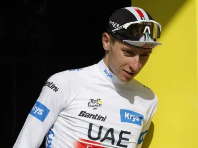 Cycling - Tour de France - Stage 17 - Saint-Gervais Mont Blanc to Courchevel - France - July 19, 2023 UAE Team Emirates' Tadej Pogacar on the podium wearing the white jersey after stage 17 REUTERS/Stephane Mahe