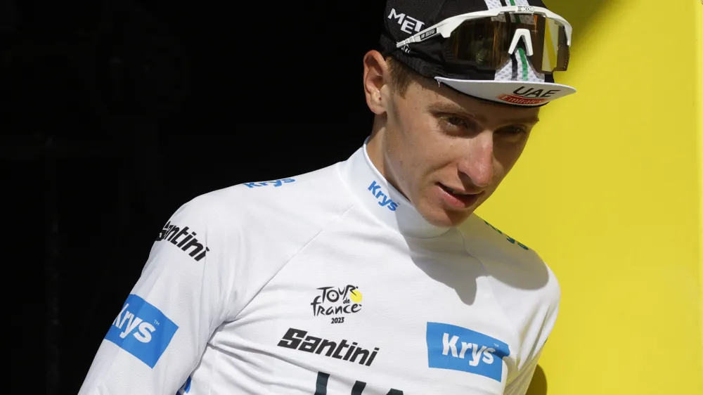 Cycling - Tour de France - Stage 17 - Saint-Gervais Mont Blanc to Courchevel - France - July 19, 2023 UAE Team Emirates' Tadej Pogacar on the podium wearing the white jersey after stage 17 REUTERS/Stephane Mahe