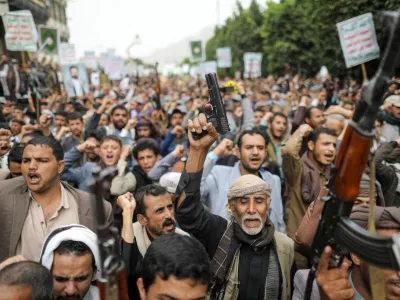 Men hold firearms as people demonstrate against the desecration of the Koran in Denmark, in Sanaa, Yemen July 24, 2023. REUTERS/Khaled Abdullah   TPX IMAGES OF THE DAY