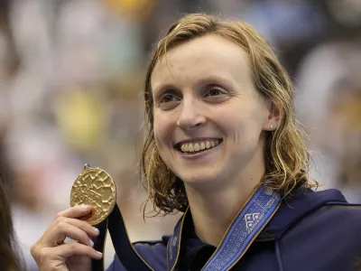 Gold medalist Katie Ledecky of United States holds her medal during ceremonies at women's 1500m freestyle finals at the World Swimming Championships in Fukuoka, Japan, Tuesday, July 25, 2023. (AP Photo/Lee Jin-man)