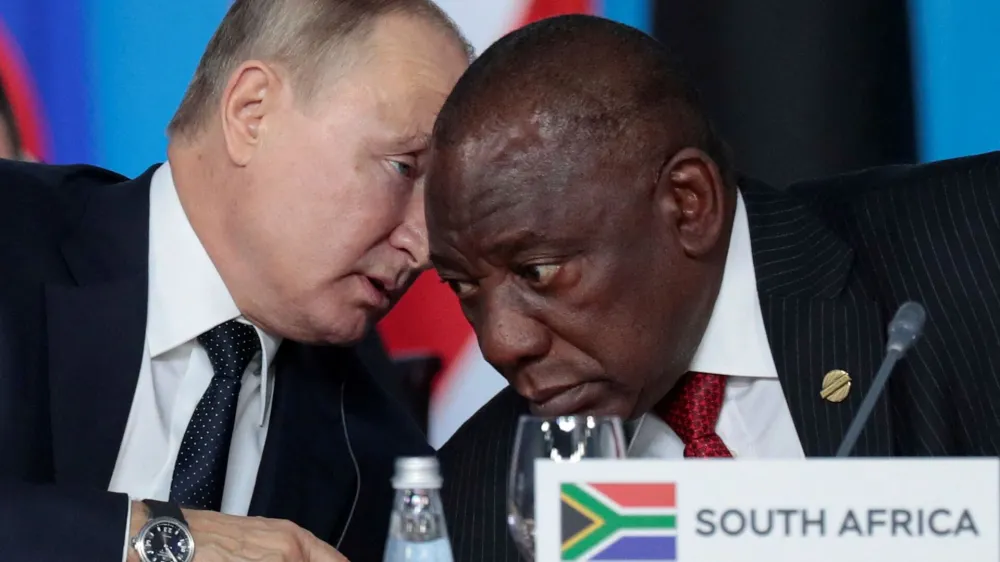 FILE PHOTO: Russia's President Vladimir Putin speaks with South African President Cyril Ramaphosa at the first plenary session as part of the 2019 Russia-Africa Summit at the Sirius Park of Science and Art in Sochi, Russia, October 24, 2019. Sergei Chirikov/Pool via REUTERS/File Photo