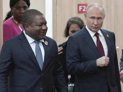 Russian President Vladimir Putin, right, and Mozambique President Filipe Nyusi arrive for a meeting on the sidelines of the Russia-Africa Summit and Economic and Humanitarian Forum in St. Petersburg, Russia, Thursday, July 27, 2023. (Alexei Danichev, Sputnik, Kremlin Pool Photo via AP)