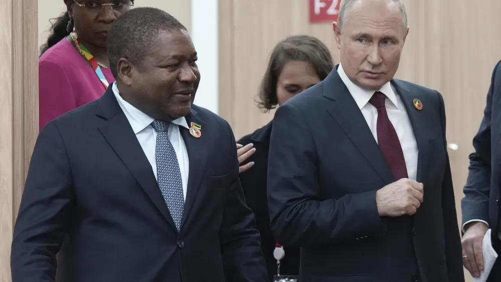 Russian President Vladimir Putin, right, and Mozambique President Filipe Nyusi arrive for a meeting on the sidelines of the Russia-Africa Summit and Economic and Humanitarian Forum in St. Petersburg, Russia, Thursday, July 27, 2023. (Alexei Danichev, Sputnik, Kremlin Pool Photo via AP)