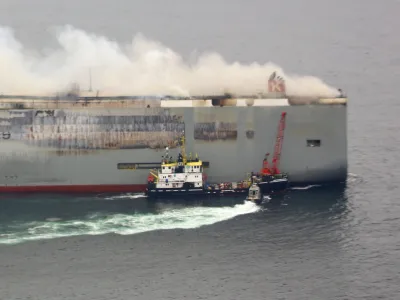 Smoke rises from burning cargo ship Fremantle Highway at sea off the Netherlands, July 28, 2023. Dutch Coastguard/Handout via REUTERS THIS IMAGE HAS BEEN SUPPLIED BY A THIRD PARTY MANDATORY CREDIT NO RESALES. NO ARCHIVES.