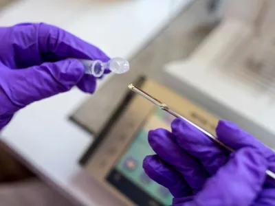 Martin Jasyk, scientific assistant at Berlin's forensic medicine department, holds a drug sample for purity testing in Berlin, Germany, July 10, 2023. Since the beginning of June people can hand in drug samples, anonymously and free of charge and have their composition tested as Berlin, popular for its club and techno scene, pioneers with this laboratory-based testing in Germany. REUTERS/Nadja Wohlleben