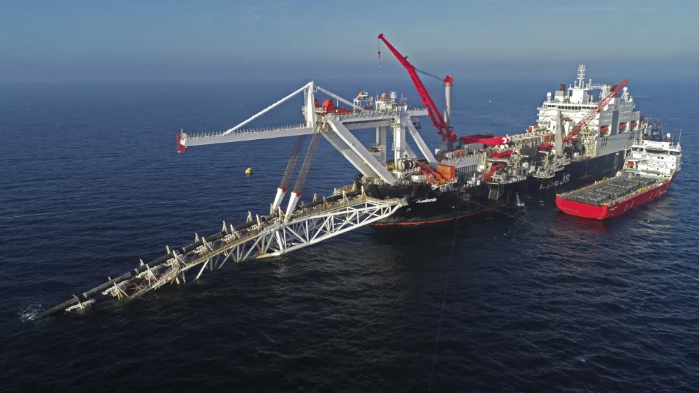 FILE - A ship works offshore in the Baltic Sea on the natural gas pipeline Nord Stream 2 from Russia to Germany, on Nov. 11, 2018. Denmark's maritime authority said Monday Sept. 26, 2022 that a gas leak had been observed in a pipeline leading from Russia to Europe underneath the Baltic Sea that is dangerous to shipping traffic. (Bernd Wuestneck/dpa via AP, File)