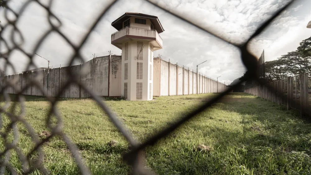 ﻿Prison with iron fences.Prison or jail is a building where people are forced to live if their freedom has been taken away.Prison is the building use for punishment prisoner.