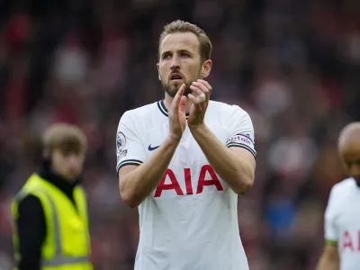 FILE - Tottenham's Harry Kane applauds fans after his team lost 4-3 at the end of an English Premier League soccer match between Liverpool and Tottenham Hotspur at Anfield stadium in Liverpool, Sunday, April 30, 2023. Bayern Munich coach Thomas Tuchel said Friday, Aug. 11, 2023, the club is still "working hard" to sign England captain Harry Kane after reports of delays in his expected transfer from Tottenham. (AP Photo/Jon Super, File)