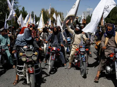 Taliban members celebrate on the second anniversary of the fall of Kabul on a street near the US embassy in Kabul, Afghanistan, August 15, 2023. REUTERS/Ali Khara