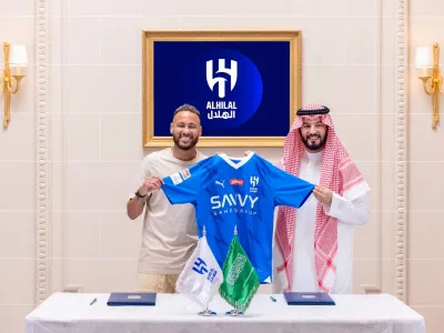 Soccer Football - Neymar signs for Al Hilal - Riyadh, Saudi Arabia - August 15, 2023 Al-Hilal's new signing Neymar holds their shirt as he poses with President Fahd bin Saad Al-Nafel Al Hilal/Handout via REUTERS??ATTENTION EDITORS - THIS IMAGE HAS BEEN SUPPLIED BY A THIRD PARTY. NO RESALES. NO ARCHIVES