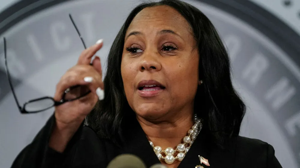 FILE PHOTO: Fulton County District Attorney Fani Willis speaks to the media after a Grand Jury brought back indictments against former president Donald Trump and 18 of his allies in their attempt to overturn the state's 2020 election results, in Atlanta, Georgia, U.S. August 14, 2023. REUTERS/Elijah Nouvelage./File Photo