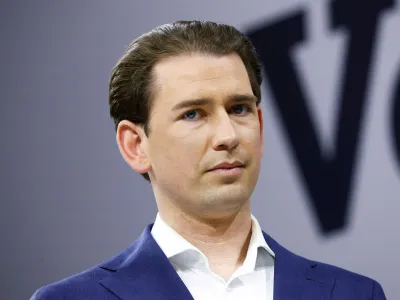 FILE PHOTO: Former Austrian Chancellor Sebastian Kurz listens as former Austrian Chancellor Wolfgang Schuessel speaks during the Austrian People's Party (OeVP) conference in Graz, Austria May 14, 2022. REUTERS/Lisa Leutner/File Photo