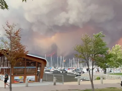 Smoke rises during the wildfire in Kelowna, British Columbia, Canada August 17, 2023, in this screen grab obtained from a social media video. Amernhel Pascua/via REUTERS THIS IMAGE HAS BEEN SUPPLIED BY A THIRD PARTY. MANDATORY CREDIT. NO RESALES. NO ARCHIVES.