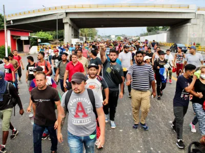 Migrants stranded in Tapachula take part in a caravan towards the U.S. after growing impatient of waiting for the humanitarian visa to cross the country, in Tapachula, Mexico April 26, 2022. REUTERS/Jose Torres