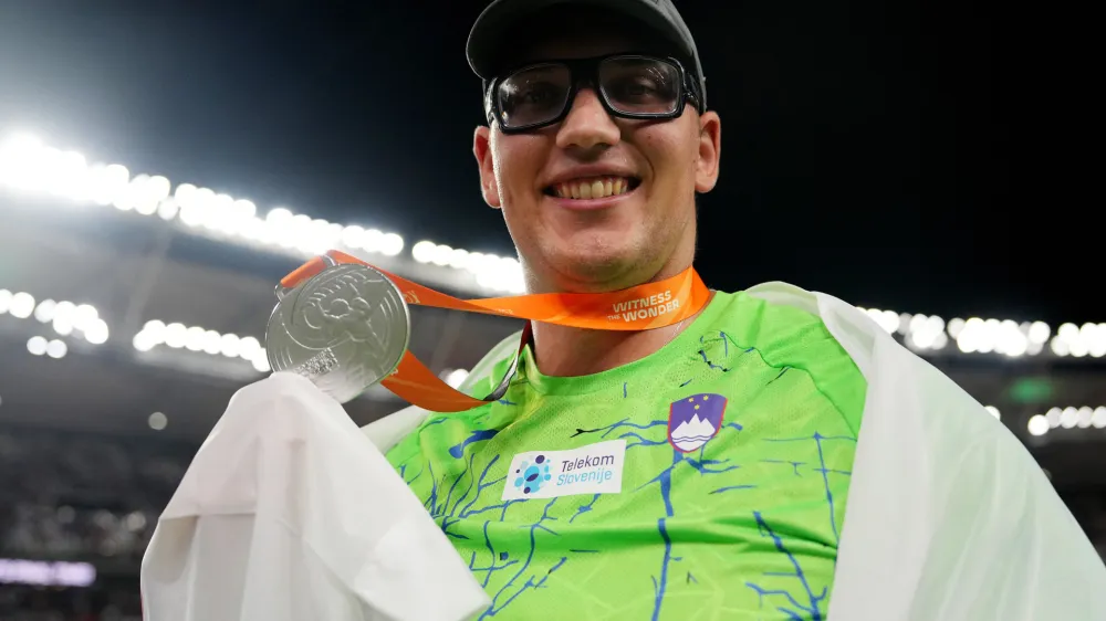 Athletics - World Athletics Championship - Men's Discus Throw Final - National Athletics Centre, Budapest, Hungary - August 21, 2023 Slovenia's Kristjan Ceh celebrates after winning silver REUTERS/Aleksandra Szmigiel