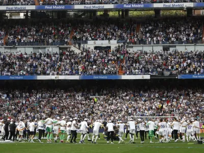 Soccer Football - LaLiga - Real Madrid v Espanyol - Santiago Bernabeu, Madrid, Spain - April 30, 2022 General view as Real Madrid team members celebrate after winning LaLiga REUTERS/Susana Vera