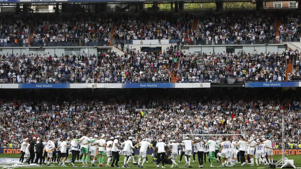 Soccer Football - LaLiga - Real Madrid v Espanyol - Santiago Bernabeu, Madrid, Spain - April 30, 2022 General view as Real Madrid team members celebrate after winning LaLiga REUTERS/Susana Vera