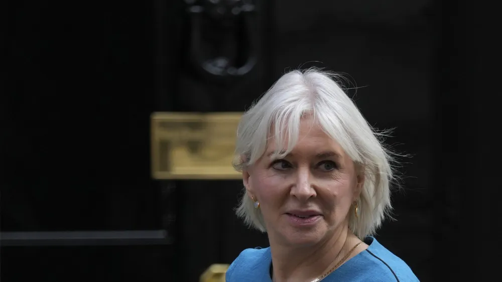 FILE - Britain's Secretary of State for Digital, Culture, Media Nadine Dorries leaves 10 Downing Street following a cabinet meeting where the cabinet were given details of the Spring Statement by the Rishi Sunak Chancellor of the Exchequer in London, on March 23, 2022. British Conservative lawmaker Nadine Dorries finally stepped down from Parliament on Saturday Aug. 26, 2023, more than two months after announcing she was quitting in the wake of former Prime Minister Boris Johnson's resignation from Parliament. (AP Photo/Alastair Grant, File)