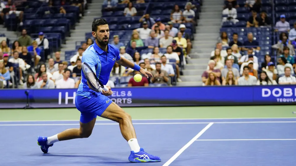 Novak Djokovic, of Serbia, returns a shot to Alexandre Muller, of France, during the first round of the U.S. Open tennis championships, Tuesday, Aug. 29, 2023, in New York. (AP Photo/Frank Franklin II)