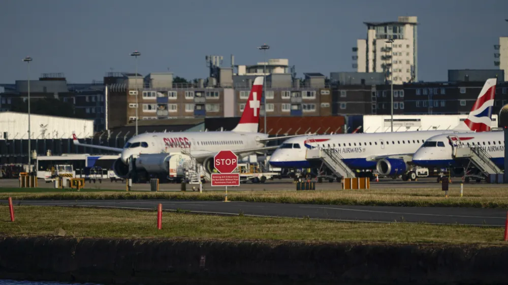 Airplanes are grounded at London City Airport, in London, Monday, Aug. 28, 2023. Britain's air traffic control system says it has fixed a "technical issue" that caused heavy delays and cancellations. National Air Traffic Services says it has "identified and remedied" a problem that meant flight plans had to be input manually for several hours on Monday. (AP Photo/Alberto Pezzali)