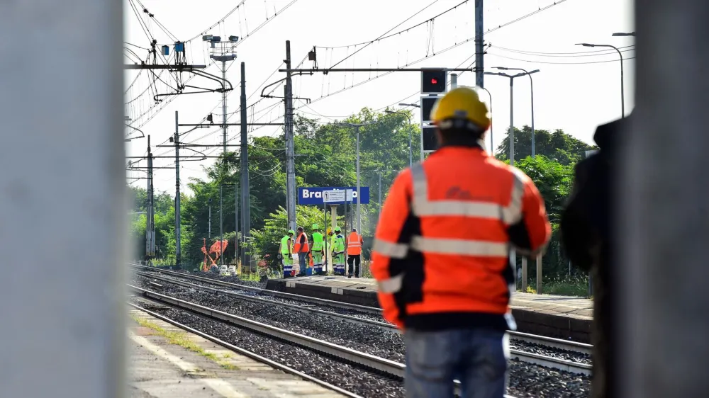 Officials walk on rail tracks on the site of a train accident in which workers were killed, in Brandizzo, Italy, August 31, 2023. REUTERS/Massimo Pinca