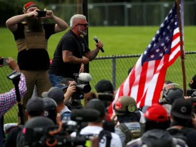 FILE PHOTO: Proud Boys member Joe Biggs speaks during a rally in Portland, Oregon, September 26, 2020, before he was later arrested for his involvement in the storming of the U.S. Capitol building in Washington. D.C., U.S. REUTERS/Jim Urquhart/File Photo