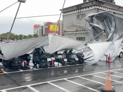 A collapsed canopy is seen at a parking lot as Typhoon Haikui approaches, in Hualien, Taiwan September 3, 2023, in this screengrab taken from a video provided by CTI. CTI via REUTERS THIS IMAGE HAS BEEN SUPPLIED BY A THIRD PARTY. NO RESALES. NO ARCHIVES. MANDATORY CREDIT. TAIWAN OUT. NO COMMERCIAL OR EDITORIAL SALES IN TAIWAN