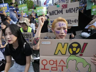 A protester shouts slogans during a rally to demand the stop of the Japan's release of treated radioactive water from the damaged Fukushima nuclear power plant into the sea and denounce the South Korean government's policy in Seoul, South Korea, Saturday, Sept. 2, 2023. (AP Photo/Ahn Young-joon)