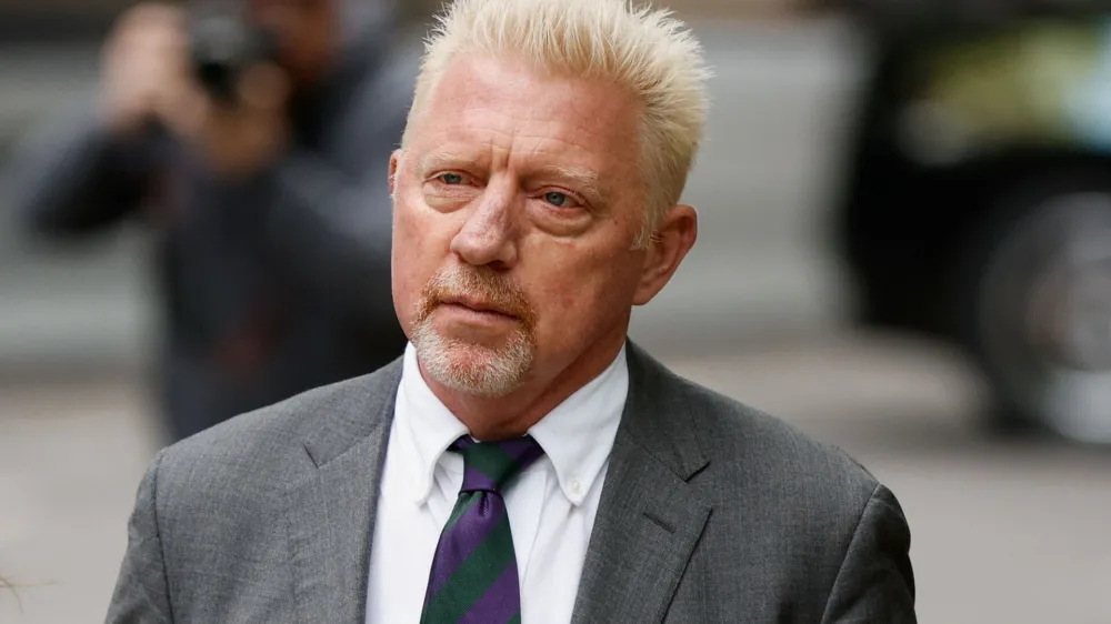 Former tennis player Boris Becker arrives with his partner Lilian de Carvalho Monteiro (not pictured) at Southwark Crown Court to face sentencing after being found guilty of four charges earlier this month, in London, Britain, April 29, 2022. REUTERS/John Sibley