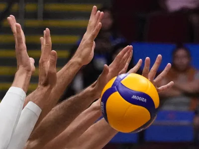 Italian men's team blocks the ball from Canada team during their game at the Men's Volleyball Nations League leg in Manila, Philippines on Thursday July 6, 2023. (AP Photo/Aaron Favila)