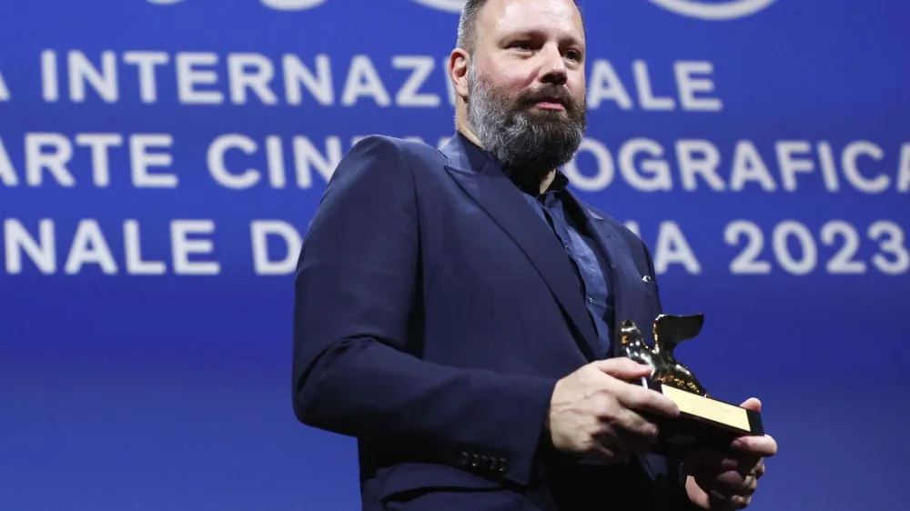 The 80th Venice Film Festival - Awards Ceremony - Venice, Italy, September 9, 2023. Director Yorgos Lanthimos poses with Golden Lion Award for Best Film for the movie 'Poor Things'. REUTERS/Guglielmo Mangiapane