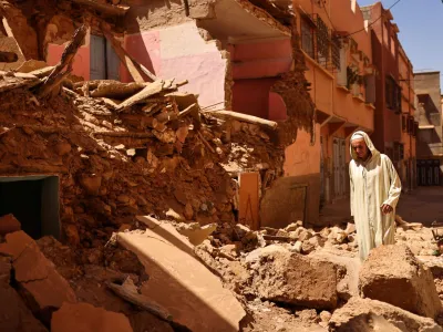 Mohamed Sebbagh, 66, stands in front of his destroyed house, in the aftermath of a deadly earthquake, in Amizmiz, Morocco, September 10, 2023. REUTERS/Nacho Doce   TPX IMAGES OF THE DAY