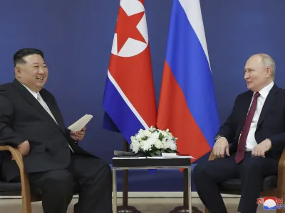 In this photo provided by the North Korean government, North Korean leader Kim Jong Un, left, and Russian President Vladimir Putin talk at the Vostochny cosmodrome outside the city of Tsiolkovsky, about 200 kilometers (125 miles) from the city of Blagoveshchensk in the far eastern Amur region, Russia, Wednesday, Sept. 13, 2023. Independent journalists were not given access to cover the event depicted in this image distributed by the North Korean government. The content of this image is as provided and cannot be independently verified. Korean language watermark on image as provided by source reads: "KCNA" which is the abbreviation for Korean Central News Agency. (Korean Central News Agency/Korea News Service via AP)