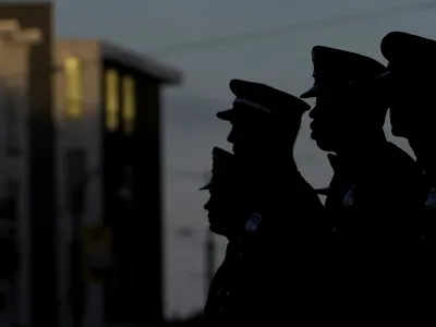 San Francisco Firefighters listen as the names of the firefighters and emergency responders who lost their lives on Sept. 11, 2001, are read at a fire station in San Francisco, Monday, Sept. 11, 2023. Americans are looking back on the horror and legacy of 9/11, gathering Monday, Sept. 11, 2023, at memorials, firehouses, city halls and elsewhere to observe the 22nd anniversary of the deadliest terror attack on U.S. soil. (AP Photo/Jeff Chiu)