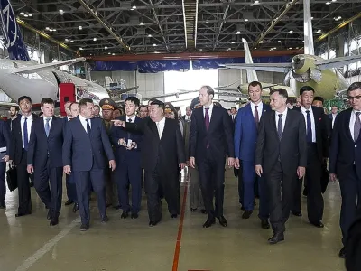 In this photo released by the governor of the Russian far eastern region of Khabarovsky Krai region Mikhail Degtyarev telegram channel, North Korean leader Kim Jong Un, center, and Deputy Prime Minister and Minister of Trade and Industry Denis Manturov, center right, visit a Russian aircraft plant that builds fighter jets in Komsomolsk-on-Amur, about 6,200 kilometers (3,900 miles) east of Moscow, Russia. (The governor of the Russian far eastern region of Khabarovsky Krai region Mikhail Degtyarev telegram channel via AP)