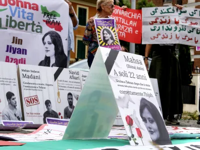 People attend a protest rally in Rome, Italy, Saturday, Sept. 16, 2023 to mark the first anniversary of the death of Mahsa Amini in the custody of Iran's morality police. (Mauro Scrobogna/LaPresse via AP)