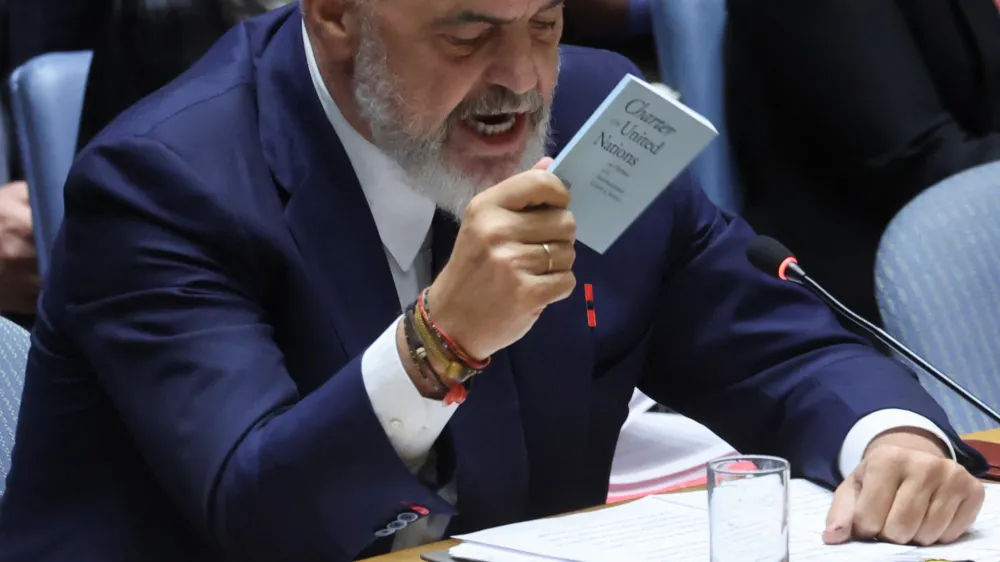 Albania's Prime Minister Edi Rama, serving as President of the United Nations Security Council, holds up a copy of the United Nations Charter in the midst of an exchange with Russia's Ambassador to the United Nations Vasily Nebenzya during a ministerial level meeting on the crisis in Ukraine at U.N. headquarters in New York, September 20, 2023. REUTERS/Mike Segar