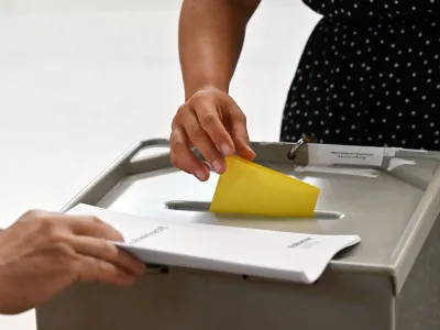 FILED - 25 June 2023, Thuringia, Sonneberg: A woman votes at the polling station in the Meng-Haemm Arena for the runoff election of the district administrator in Sonneberg County. According to a new study, far-right extremist attitudes have increased sharply in Germany since 2021, with the researchers determining that one in 12 adults now hold an extreme right-wing worldview. Photo: Martin Schutt/dpa