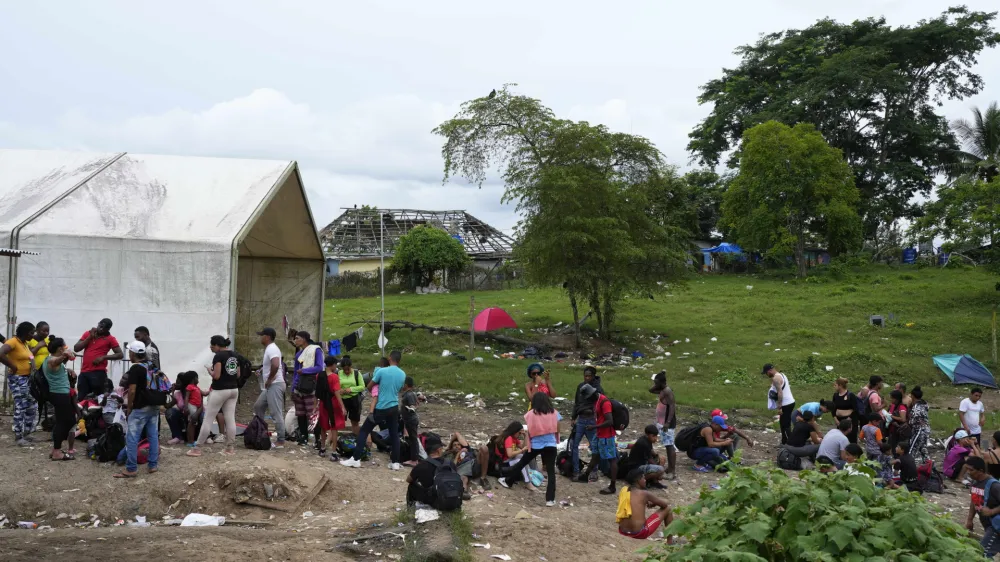 Migrants trying to reach the United States gather on a makeshift camp in Lajas Blancas, Darien province, Panama, Saturday, Sept. 23, 2023. (AP Photo/Arnulfo Franco)