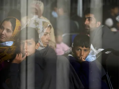 FILE - Evacuees from Afghanistan wait with other evacuees to fly to the United States or another safe location in a makeshift departure gate inside a hanger at the United States Air Base in Ramstein, Germany, Sept. 1, 2021. The Afghan man who speaks only Farsi represented himself in U.S. immigration court, and the judge denied him asylum. The Associated Press obtained a transcript of the hearing that offers a rare look inside an opaque and overwhelmed immigration court system where hearings are closed and judges are under pressure to move quickly given the backlog of 2 million cases. (AP Photo/Markus Schreiber, File)