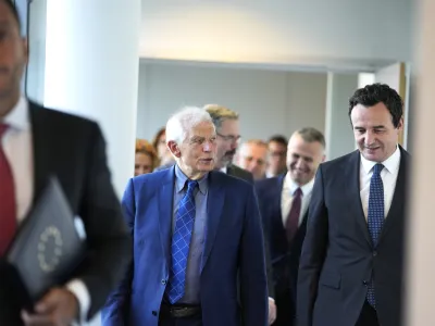 Kosovo's Prime Minister Albin Kurti, right, walks with European Union foreign policy chief Josep Borrell, center, prior to a meeting in Brussels, Thursday, Sept. 14, 2023. The leaders of Serbia and Kosovo are holding a fresh round of meetings on Thursday aimed at improving their strained relations as calls mount for a change in the Western diplomatic approach toward them amid concern that their tensions could spiral out of control. (AP Photo/Virginia Mayo)