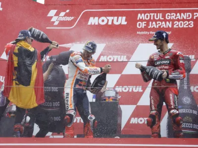 MotoGP - Japanese Grand Prix - Mobility Resort Motegi, Motegi, Japan - October 1, 2023 Prima Pramac Racing's Jorge Martin celebrates on the podium after winning the MotoGP, along with second placed Ducati Lenovo Team's Francesco Bagnaia and third placed Repsol Honda Team's Marc Marquez REUTERS/Issei Kato