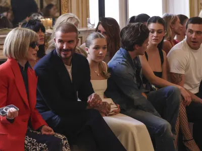 Anna Wintour, from left, David Beckham, Harper Beckham, Cruz Beckham, Nicola Peltz and Brooklyn Beckham attend the Victoria Beckham Spring/Summer 2024 womenswear fashion collection presented Friday, Sept. 29, 2023 in Paris. (AP Photo/Vianney Le Caer)