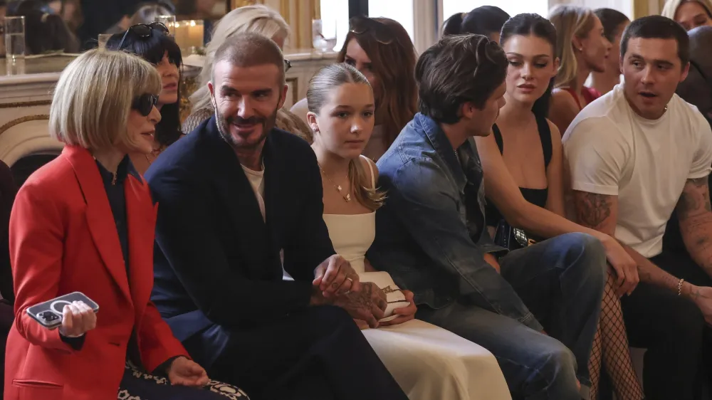 Anna Wintour, from left, David Beckham, Harper Beckham, Cruz Beckham, Nicola Peltz and Brooklyn Beckham attend the Victoria Beckham Spring/Summer 2024 womenswear fashion collection presented Friday, Sept. 29, 2023 in Paris. (AP Photo/Vianney Le Caer)