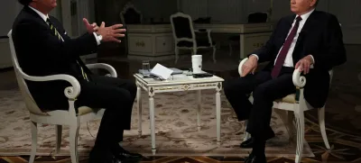 Russian President Vladimir Putin listens during an interview with U.S. television host Tucker Carlson in Moscow, Russia February 6, 2024. Sputnik/Gavriil Grigorov/Kremlin via REUTERS ATTENTION EDITORS - THIS IMAGE WAS PROVIDED BY A THIRD PARTY.