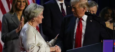 Republican presidential nominee and former U.S. President Donald Trump shakes hands with his senior advisor Susie Wiles as he speaks, following early results from the 2024 U.S. presidential election in Palm Beach County Convention Center, in West Palm Beach, Florida, U.S., November 6, 2024. REUTERS/Carlos Barria