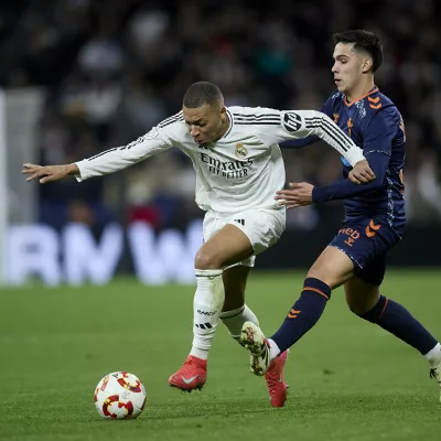 16 January 2025, Spain, Madrid: Real Madrid's Kylian Mbappe and Celta de Vigo's Hugo Sotelo battle for the ball during the Spanish Copa del Rey soccer match between Real Madrid CF and RC Celta de Vigo at Santiago Bernabeu Stadium. Photo: Ruben Albarran/ZUMA Press Wire/dpa