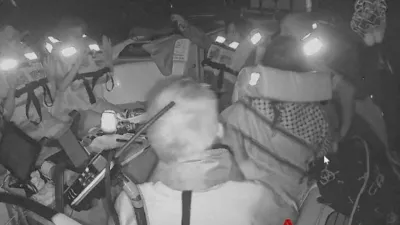 A screengrab from a live video footage shows crew members sitting aboard the Gaza-bound Aurora vessel, part of the Global Sumud Flotilla, October 1, 2025. Global Sumud Flotilla/Handout via REUTERS  THIS IMAGE HAS BEEN SUPPLIED BY A THIRD PARTY. MANDATORY CREDIT. NO RESALES. NO ARCHIVES.